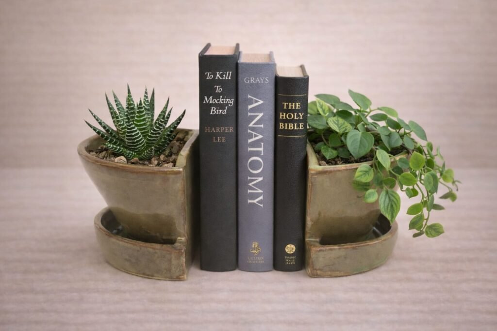 Handmade blue boookend planters ceramic set for shelf styling with plants.